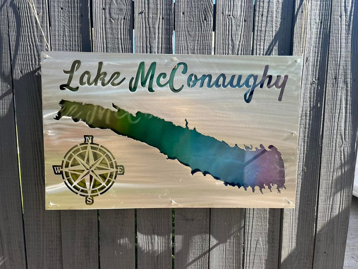 Custom Lake McConaughy aluminum lake sign mounted on a wooden fence